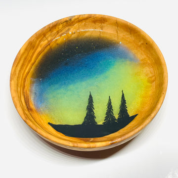 handmade jewelry, Minnesota local wood and resin artist. Northern lights, winter forest, pine tree, hand painted, olive wood bowl with glow-in-the-dark fluorescent green resin ring trinket bowl.