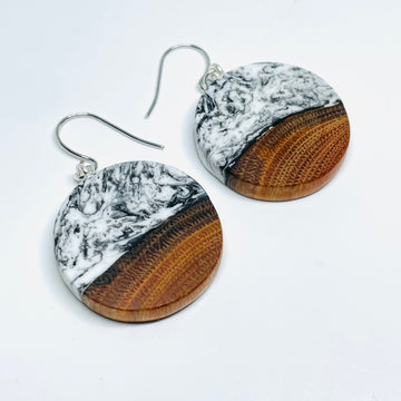 handmade jewelry, Minnesota local wood and resin artist. black and white marbled resin with buckthorn wood, nickel free dangle earrings circle shaped