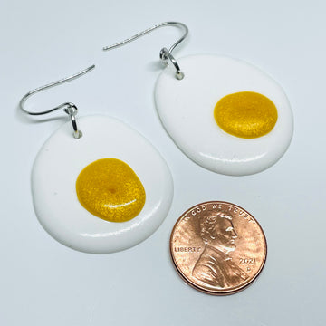 handmade jewelry, Minnesota local resin artist. Opaque white and yellow resin, fried eggs, nickel free dangle earrings.