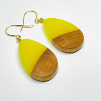handmade jewelry, Minnesota local wood and resin artist. Yellow Glow-In-The-Dark resin with a birch wood, nickel free dangle earrings teardrop shaped