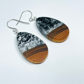 handmade jewelry, Minnesota local wood and resin artist. black and white marbled resin with buckthorn wood, nickel free dangle earrings teardrop shaped