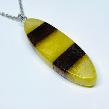 handmade jewelry, Minnesota local wood and resin artist. handmade walnut wood and resin pendant necklace, 15" stainless steel chain, yellow resin