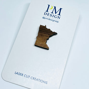 Minnesota local wood and resin artist. laser cut walnut wood, stainless steel pin back, MN State shape.
