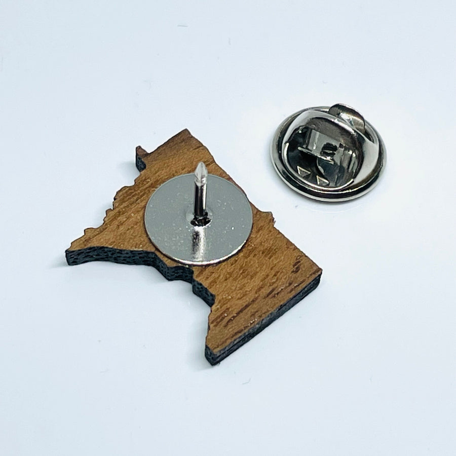 Minnesota local wood and resin artist. laser cut walnut wood, stainless steel pin back, MN State shape- back.