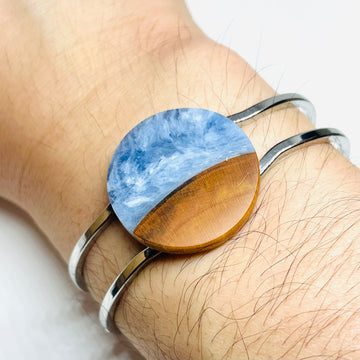 handmade jewelry, Minnesota local wood and resin artist. Ocean waves blue resin with maple wood, platinum plated bracelet