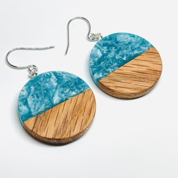 handmade jewelry, Minnesota local wood and resin artist. Ocean waves blue and green resin with white oak wood, nickel free dangle earrings circle shaped