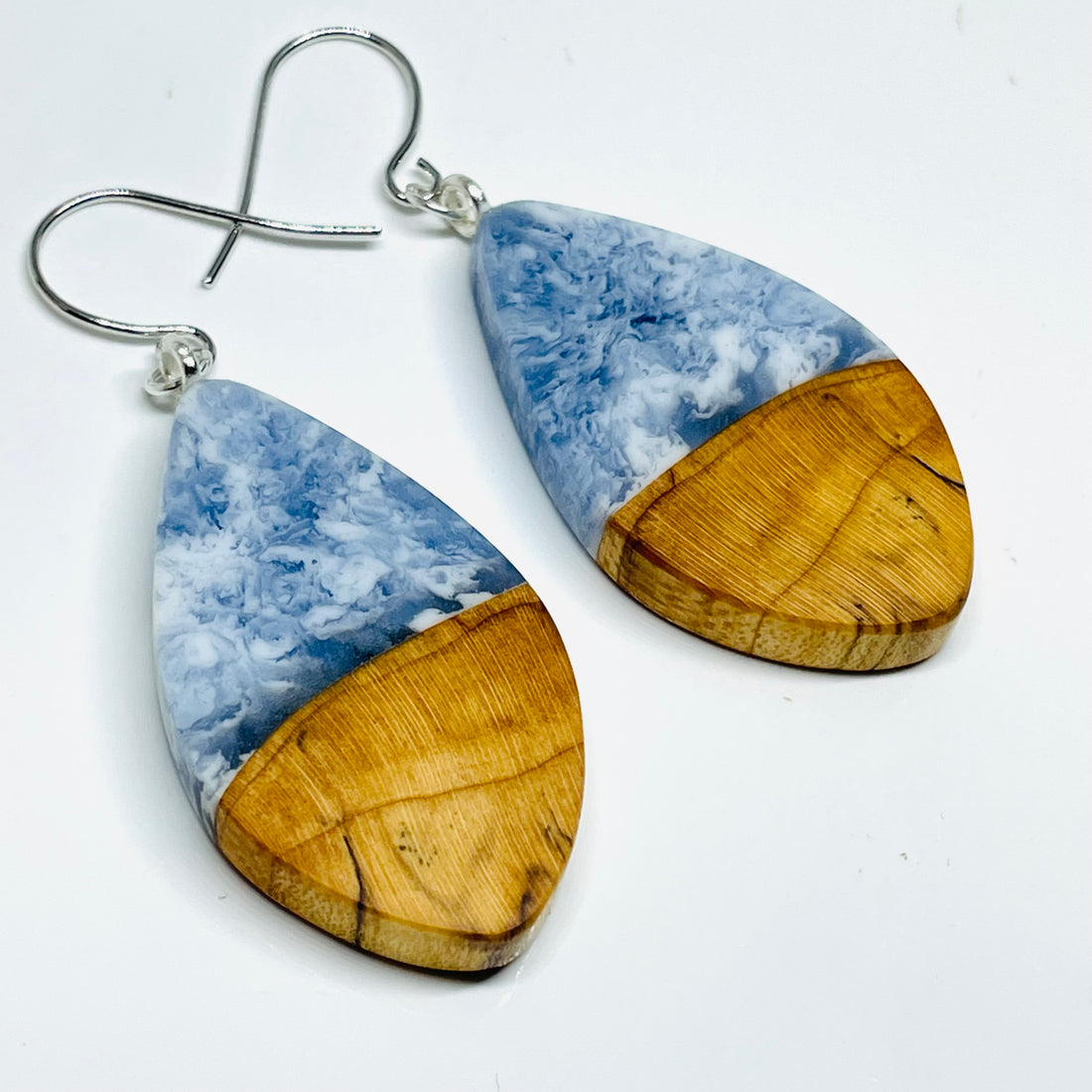 handmade jewelry, Minnesota local wood and resin artist. Maple wood with ocean waves blue resin, pod shaped, nickel free dangle hook earrings