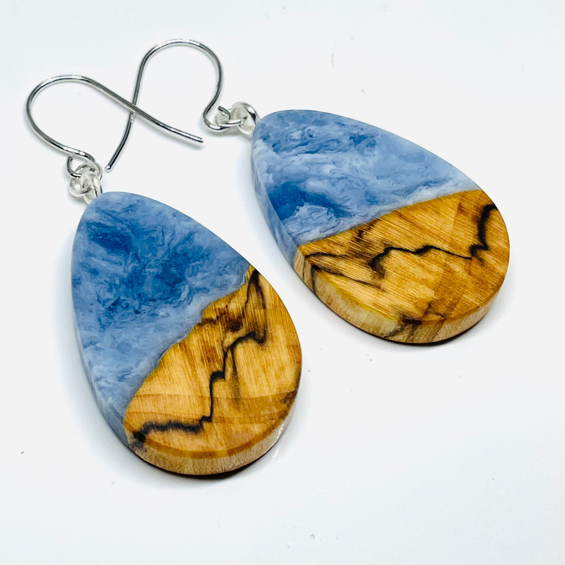 handmade jewelry, Minnesota local wood and resin artist. Ocean waves blue with spalted maple wood, nickel free dangle hook earrings.