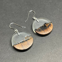 Handmade earrings made from live edge burnt walnut wood with clear resin.