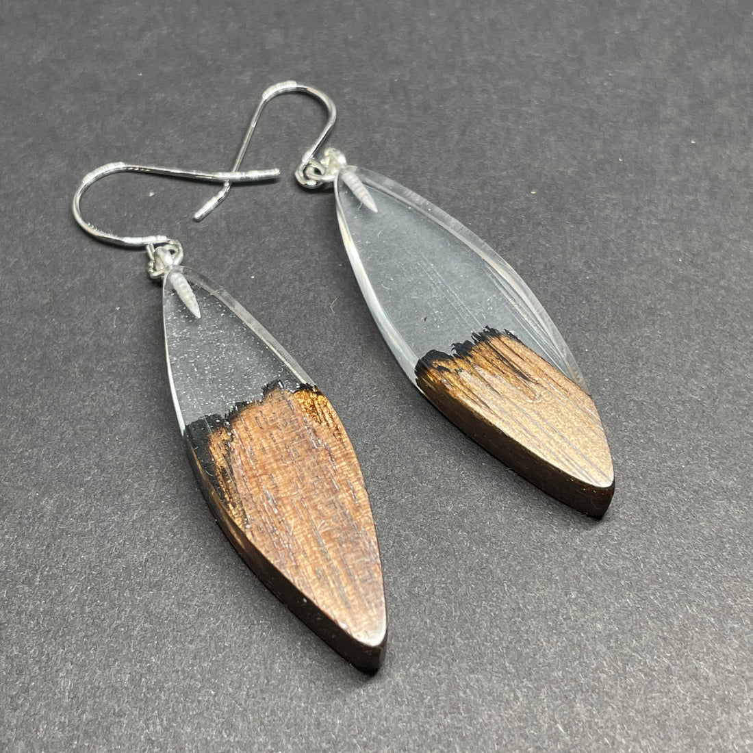 Handmade earrings made from live edge burnt walnut wood with clear resin