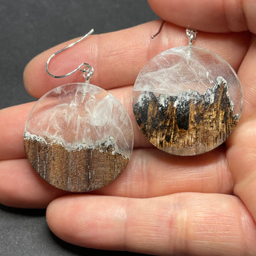 Handmade wood and resin earrings, Minnesota artist. Made of walnut wood with clear and white resin. Rhodium plated, brass core hook earrings, large round circular shape.