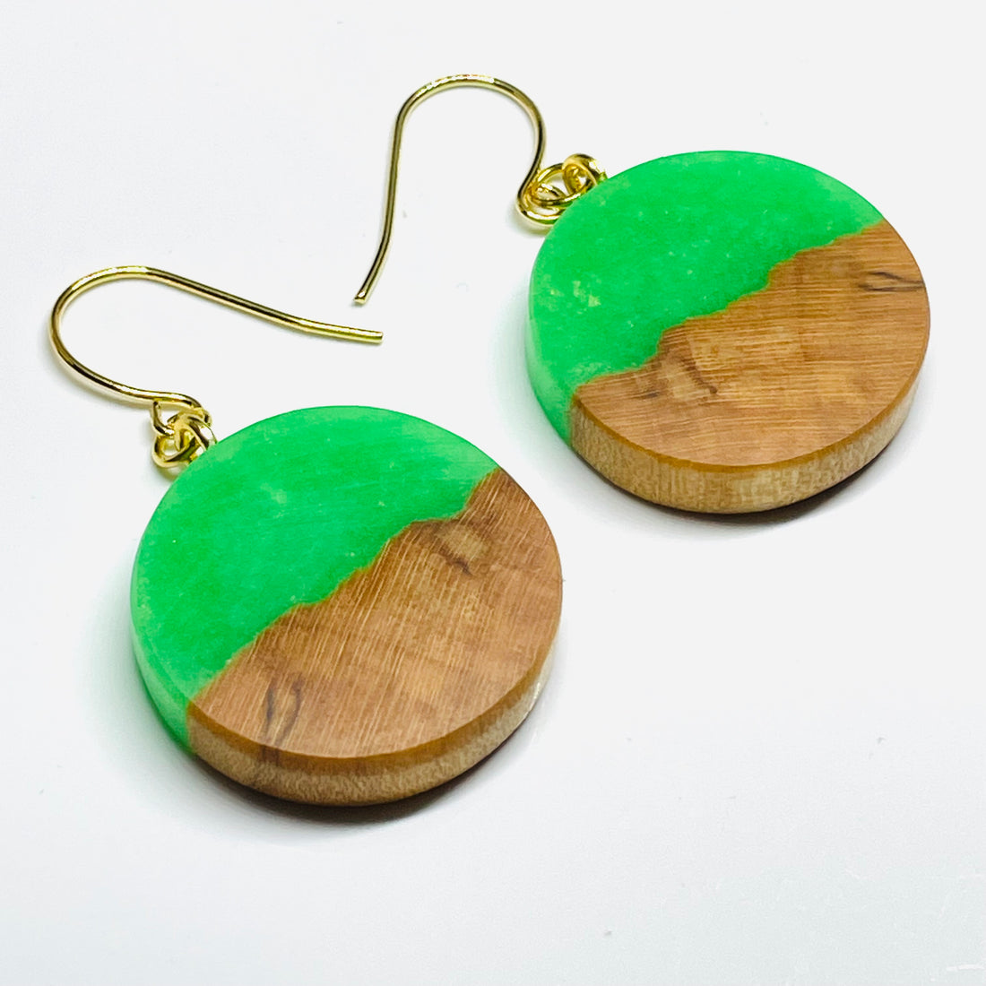 handmade jewelry, Minnesota local wood and resin artist. Green Glow-In-The-Dark resin with a maple wood, nickel free dangle earrings circle shaped