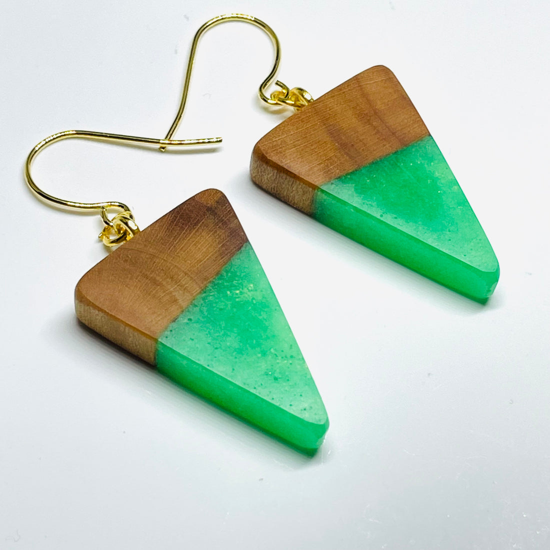 handmade jewelry, Minnesota local wood and resin artist. Green Glow-In-The-Dark resin with a maple wood, nickel free dangle earrings tiny isosceles shaped