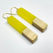 handmade jewelry, Minnesota local wood and resin artist. Yellow Glow-In-The-Dark resin with a birch wood, nickel free dangle earrings stem shaped