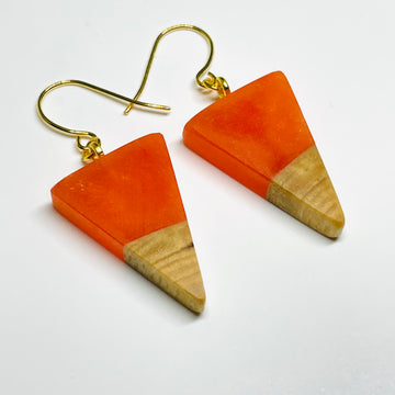 Handmade in Minnesota. Maple wood and orange resin isosceles shaped earrings.