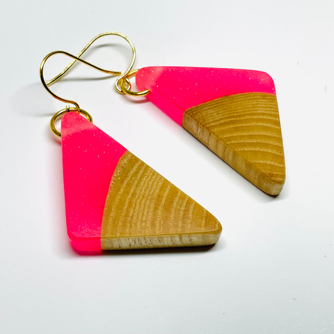 handmade jewelry, Minnesota local wood and resin artist. Pink resin with birch wood, nickel free dangle earrings triangle shaped