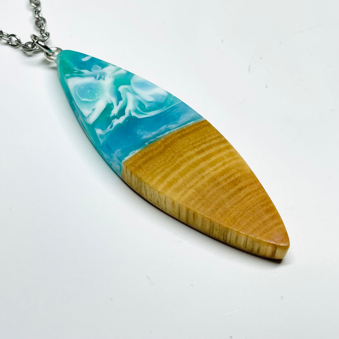 Handmade pendant/necklace from spalted maple wood with&nbsp;green, blue&nbsp;and white resin.