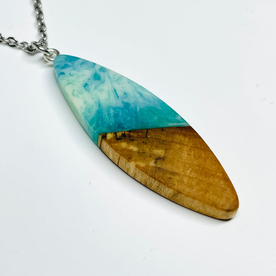 handmade jewelry, Minnesota local wood and resin artist. handmade maple wood and resin pendant necklace, 15" stainless steel chain, Pacific shores ocean waves blue and green