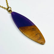 handmade jewelry, Minnesota local wood and resin artist. handmade maple wood and purple resin sliver shaped pendant necklace, 15" gold colored stainless steel chain