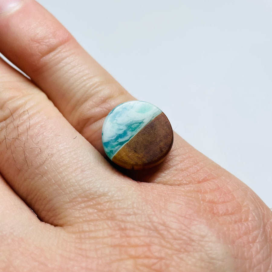 handmade jewelry, Minnesota local wood and resin artist. Ocean waves blue, green and white resin with maple wood, circle shaped stainless steel adjustable ring