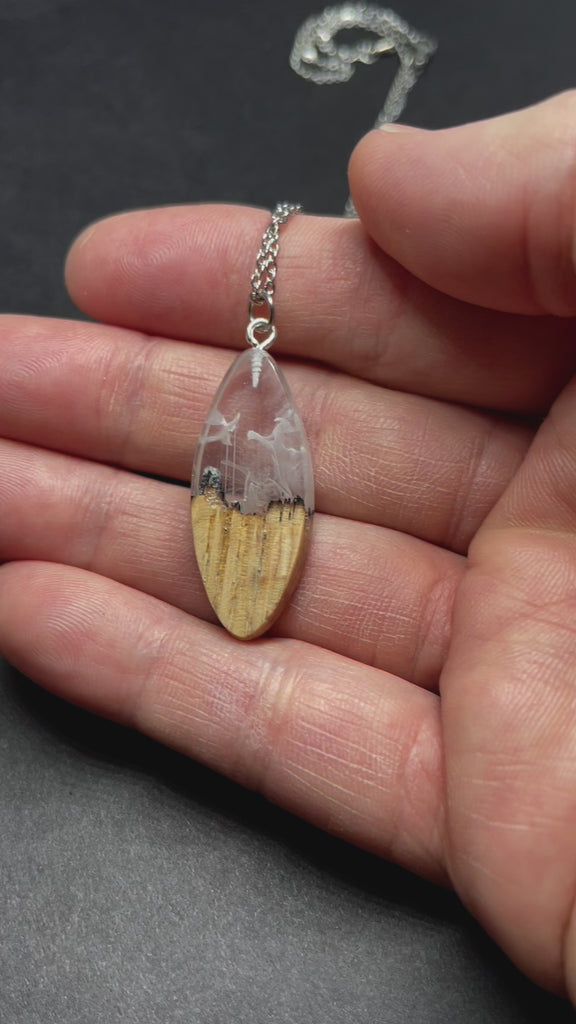 handmade jewelry, Minnesota local wood and resin artist. handmade ash wood and clear and white resin pendant necklace, 9" stainless steel chain, Winter blizzard mountain landscape short sliver video