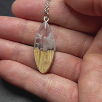 handmade jewelry, Minnesota local wood and resin artist. handmade ash wood and clear and white resin pendant necklace, 9" stainless steel chain, Winter blizzard mountain landscape short sliver video