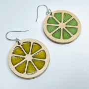 Laser Cut earrings with lemon yellow and lime green resin. , Minnesota local wood and resin artist. Maple wood, nickel free dangle earrings citrus slice circle shaped