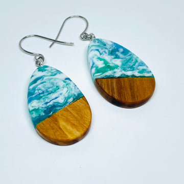 handmade jewelry, Minnesota local wood and resin artist. Ocean waves blue, green and white resin with maple wood, nickel free dangle earrings teardrop shaped