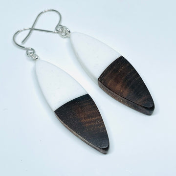 handmade jewelry, Minnesota local wood and resin artist. Opaque white resin with walnut wood, nickel free dangle earrings sliver shaped